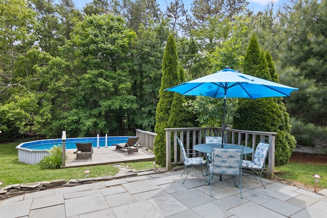 18 Chivalry Ln, Nesconset, NY 11767 - view of patio featuring outdoor dining area, an outdoor pool, and a deck