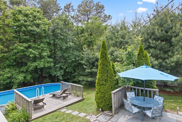 18 Chivalry Ln, Nesconset, NY 11767 - swimming pool featuring a deck, a yard, and outdoor dining space