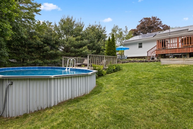 18 Chivalry Ln, Nesconset, NY 11767 - outdoor pool with a wooden deck and a yard