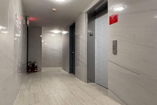 132-27 41st Rd Unit 4A, Flushing, NY 11355 - hall with tile walls and elevator