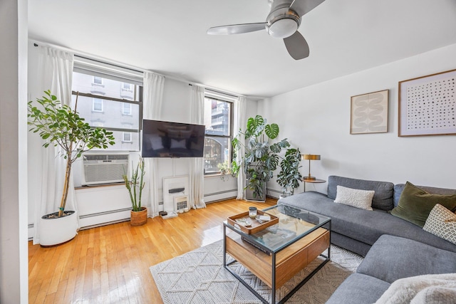219 Berry St Unit 2, Brooklyn, NY 11249 - living room featuring a baseboard heating unit, hardwood / wood-style floors, baseboard heating, ceiling fan, and cooling unit