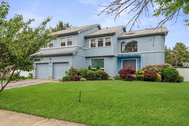 204 Carnation Dr, Farmingdale, NY 11735 - view of front of property featuring a garage, a front yard, and driveway
