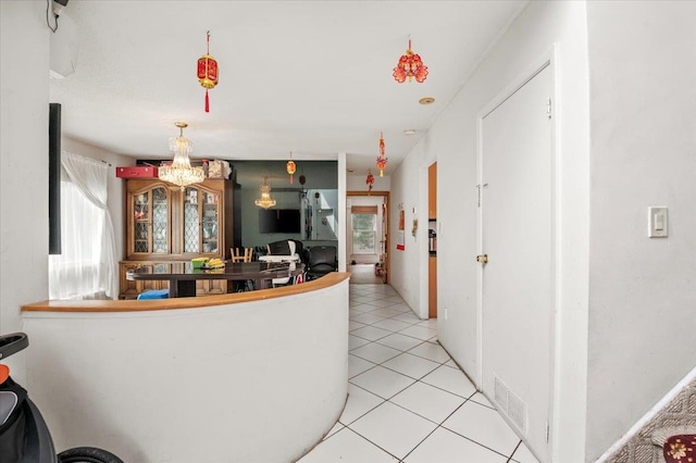 204 Carnation Dr, Farmingdale, NY 11735 - kitchen with a chandelier and light tile patterned floors