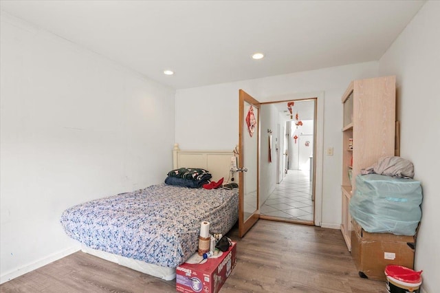 204 Carnation Dr, Farmingdale, NY 11735 - bedroom with wood finished floors, recessed lighting, and baseboards
