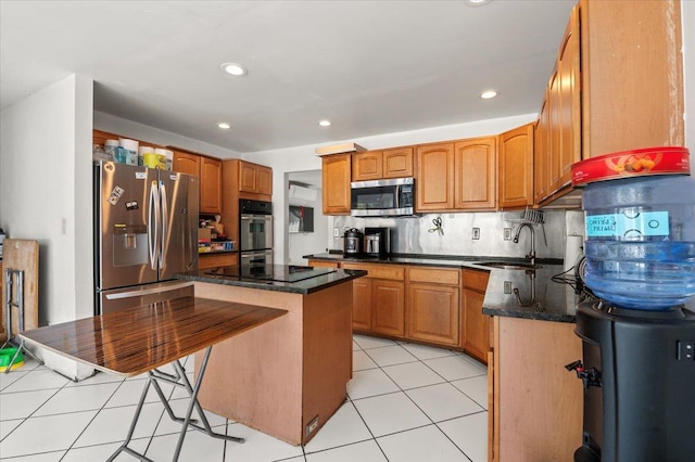 204 Carnation Dr, Farmingdale, NY 11735 - kitchen with stainless steel appliances, a sink, light tile patterned floors, dark stone counters, and recessed lighting