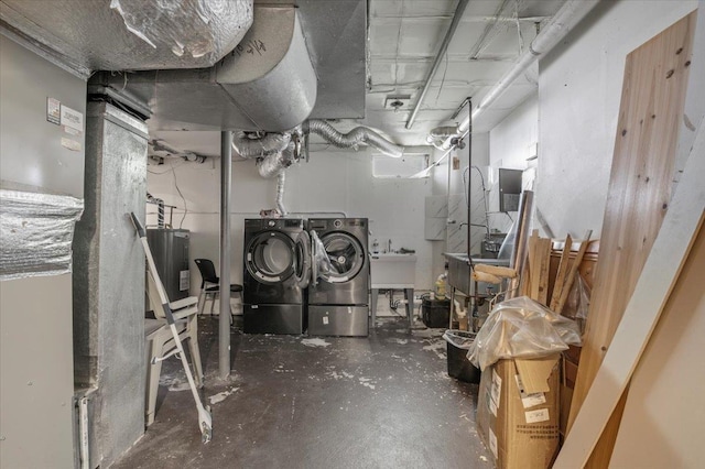 204 Carnation Dr, Farmingdale, NY 11735 - unfinished below grade area featuring washer and clothes dryer, water heater, and a sink