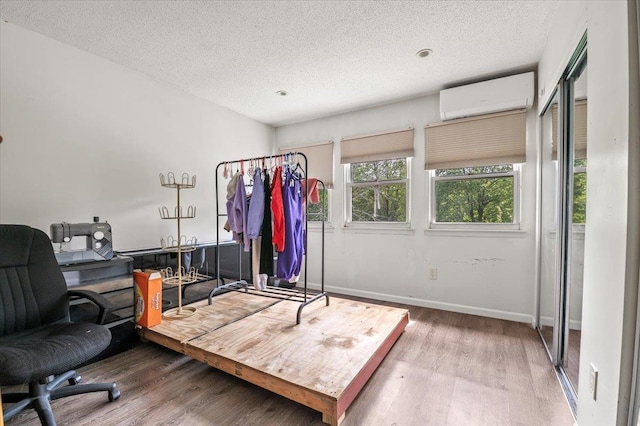 204 Carnation Dr, Farmingdale, NY 11735 - office space with a wall unit AC, wood finished floors, and a textured ceiling