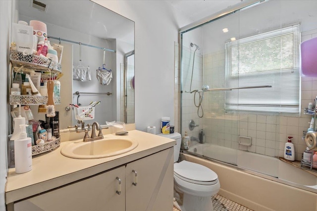 204 Carnation Dr, Farmingdale, NY 11735 - full bathroom with vanity, shower / bath combination with glass door, toilet, and tile patterned floors