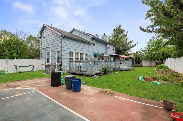 204 Carnation Dr, Farmingdale, NY 11735 - back of house featuring a chimney and a deck