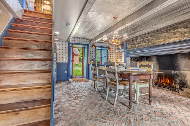 1282 Old Post Rd, Ulster Park, NY 12487 - dining area with brick flooring, a chandelier, and stairs
