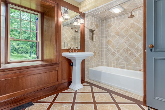 1282 Old Post Rd, Ulster Park, NY 12487 - bathroom with inlaid floor details, plenty of natural light, and shower / bath combination