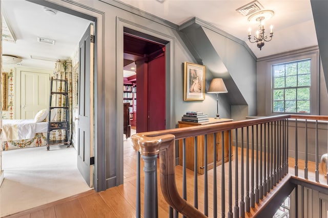 1282 Old Post Rd, Ulster Park, NY 12487 - hallway featuring a chandelier and wood finished floors