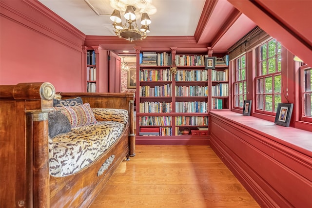 1282 Old Post Rd, Ulster Park, NY 12487 - living area featuring crown molding, light wood-style floors, and a chandelier