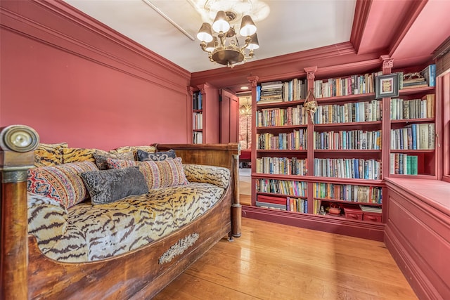 1282 Old Post Rd, Ulster Park, NY 12487 - living area featuring a chandelier, wood finished floors, and ornamental molding