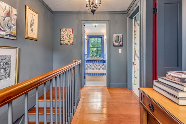 1282 Old Post Rd, Ulster Park, NY 12487 - hall with light wood-style flooring, ornamental molding, an upstairs landing, and baseboards