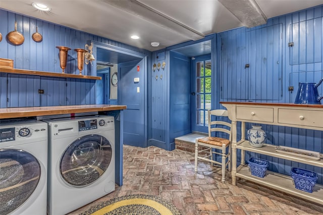 1282 Old Post Rd, Ulster Park, NY 12487 - laundry room with brick flooring, washing machine and clothes dryer, and wood walls