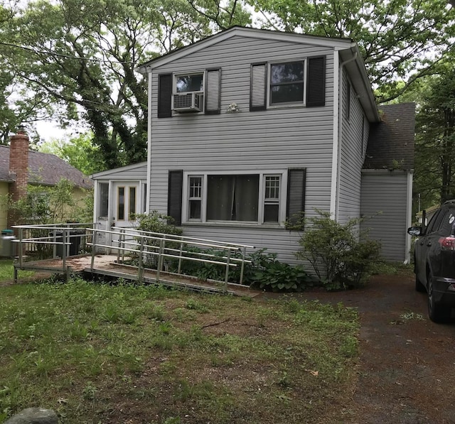 27 Atlantic Dr, Sound Beach, NY 11789 - view of front of property featuring a wooden deck and cooling unit
