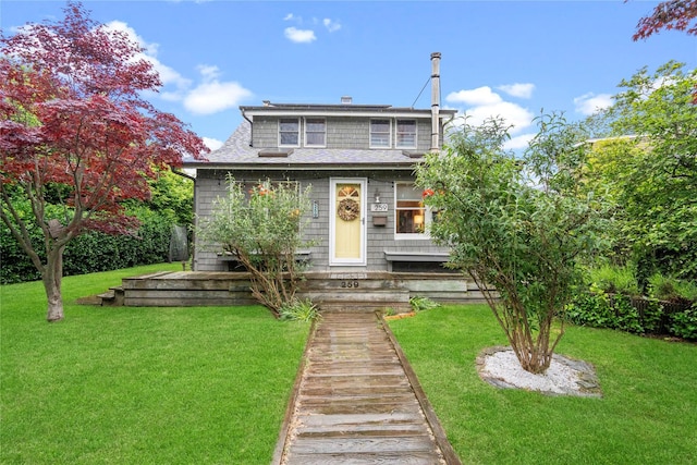 259 Foster Ave, Sayville, NY 11782 - view of front facade featuring a front yard and roof with shingles