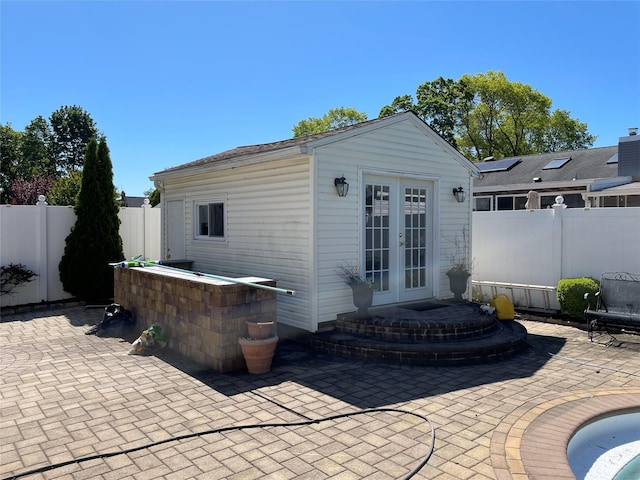 74 Webster Ave, West Islip, NY 11795 - fenced backyard featuring french doors and a patio area