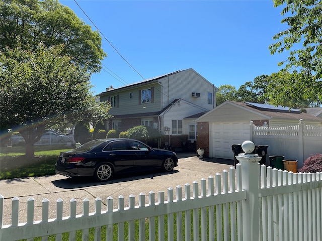 74 Webster Ave, West Islip, NY 11795 - view of front facade featuring brick siding, an attached garage, and concrete driveway