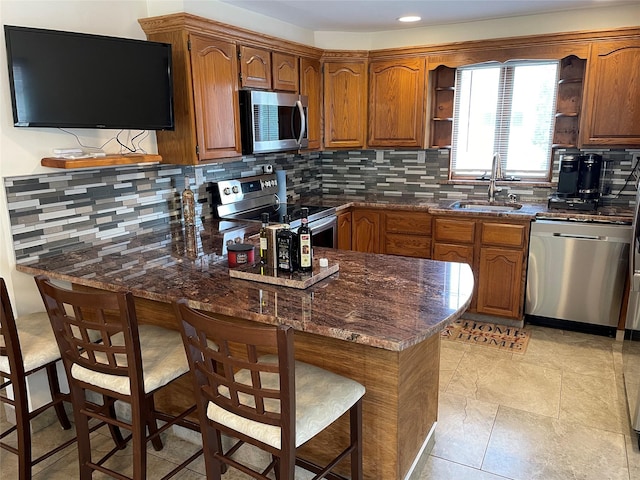 74 Webster Ave, West Islip, NY 11795 - kitchen featuring appliances with stainless steel finishes, a sink, a peninsula, open shelves, and decorative backsplash