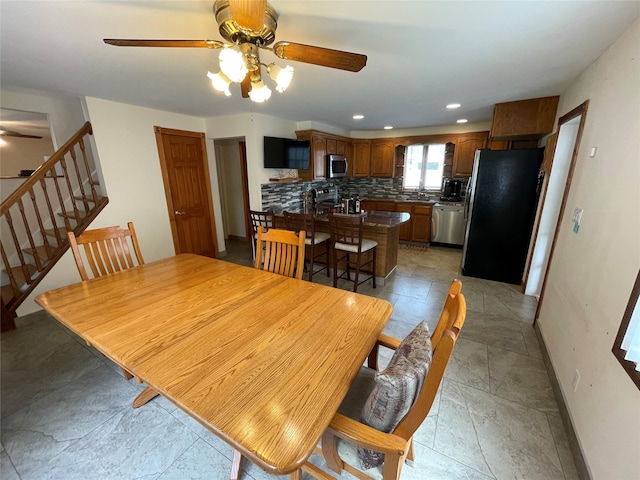 74 Webster Ave, West Islip, NY 11795 - dining area featuring a ceiling fan, stairway, baseboards, and recessed lighting