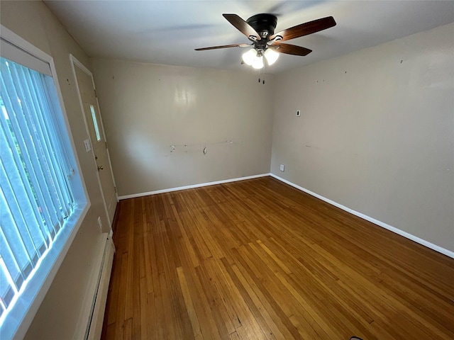74 Webster Ave, West Islip, NY 11795 - empty room featuring plenty of natural light, a ceiling fan, and hardwood / wood-style floors