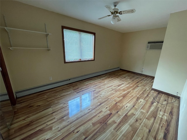 74 Webster Ave, West Islip, NY 11795 - unfurnished bedroom featuring a baseboard radiator, light wood finished floors, a wall mounted air conditioner, and ceiling fan