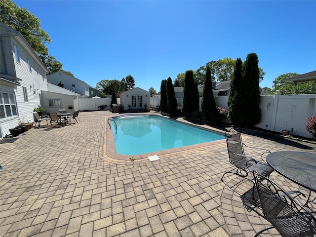 74 Webster Ave, West Islip, NY 11795 - view of swimming pool featuring a fenced backyard, a patio, and french doors
