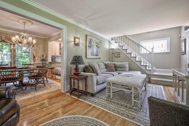 23 S Sixth St, Locust Valley, NY 11560 - living area featuring a chandelier, wood finished floors, crown molding, stairway, and baseboards