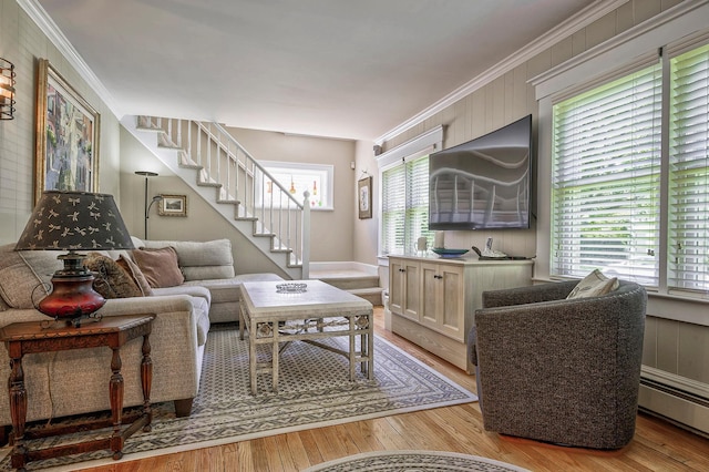 23 S Sixth St, Locust Valley, NY 11560 - living area with crown molding, a baseboard radiator, light wood-style floors, and stairs