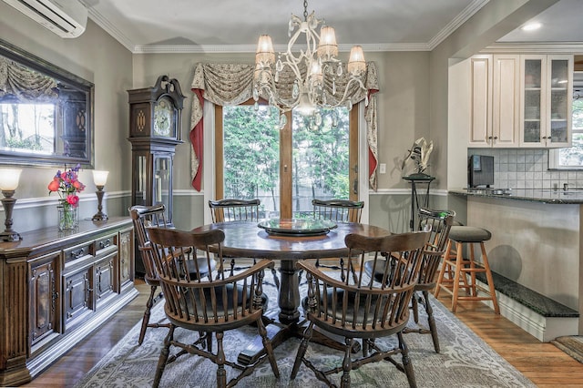 23 S Sixth St, Locust Valley, NY 11560 - dining room featuring healthy amount of natural light, a chandelier, dark wood finished floors, ornamental molding, and a wall unit AC