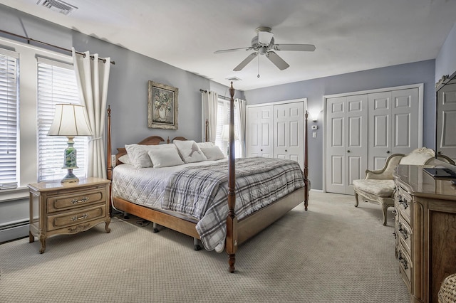 23 S Sixth St, Locust Valley, NY 11560 - bedroom with two closets, light colored carpet, and ceiling fan