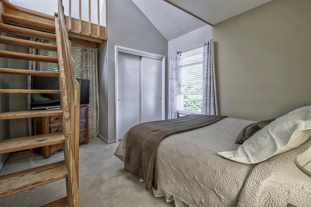 23 S Sixth St, Locust Valley, NY 11560 - bedroom with light colored carpet, a closet, and high vaulted ceiling