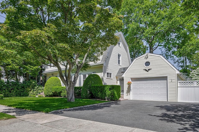 23 S Sixth St, Locust Valley, NY 11560 - dutch colonial with driveway, an attached garage, and a gambrel roof