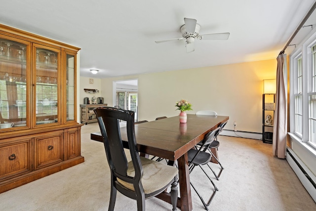 323 Harris Rd, Monticello, NY 12701 - dining room with light carpet, baseboard heating, and ceiling fan
