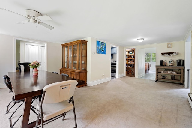 323 Harris Rd, Monticello, NY 12701 - dining room featuring ceiling fan, baseboards, and light colored carpet