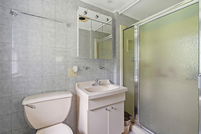 323 Harris Rd, Monticello, NY 12701 - bathroom with vanity, a shower stall, toilet, crown molding, and tile walls
