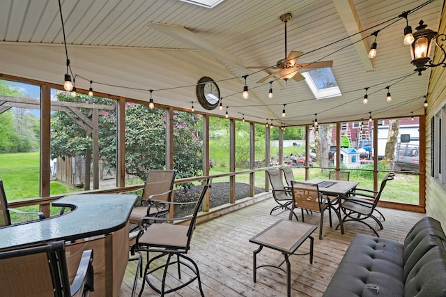 323 Harris Rd, Monticello, NY 12701 - sunroom / solarium with outdoor dining area, a skylight, ceiling fan, and a deck