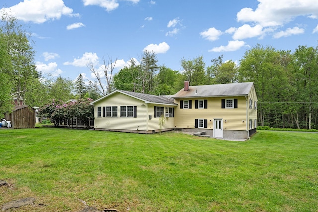 323 Harris Rd, Monticello, NY 12701 - back of property featuring a yard and a chimney