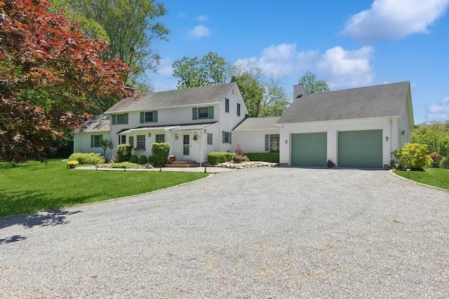 43 Hill St, Wading River, NY 11792 - view of front of home with driveway, an attached garage, and a front lawn