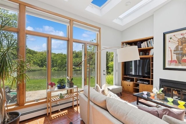 43 Hill St, Wading River, NY 11792 - tiled living room with a skylight, baseboard heating, vaulted ceiling, and a glass covered fireplace