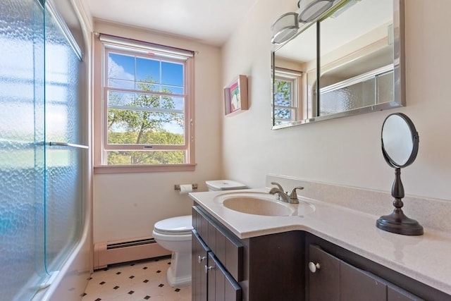 43 Hill St, Wading River, NY 11792 - bathroom with a baseboard radiator, vanity, tile patterned floors, and shower / bath combination with glass door