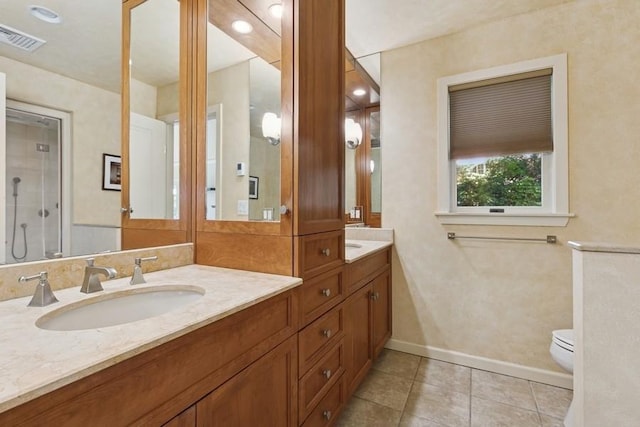 43 Hill St, Wading River, NY 11792 - bathroom with double vanity, tile patterned flooring, a shower with shower door, and recessed lighting