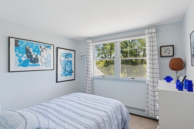43 Hill St, Wading River, NY 11792 - bedroom featuring a baseboard heating unit and carpet flooring