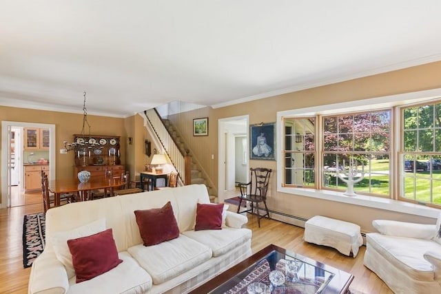 43 Hill St, Wading River, NY 11792 - living area featuring stairs, wood finished floors, baseboard heating, and ornamental molding