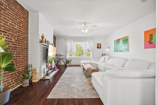 27 Locust Ave Unit 4N, New Rochelle, NY 10801 - living area with a brick fireplace, a ceiling fan, hardwood / wood-style flooring, brick wall, and baseboards