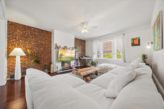 27 Locust Ave Unit 4N, New Rochelle, NY 10801 - living area with brick wall, a ceiling fan, wood finished floors, and a glass covered fireplace