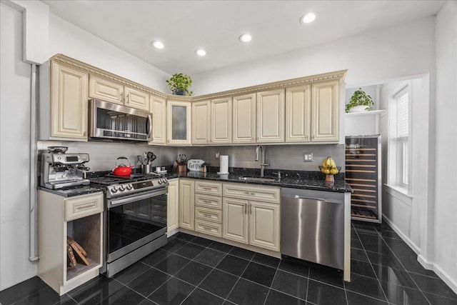 27 Locust Ave Unit 4N, New Rochelle, NY 10801 - kitchen with stainless steel appliances, cream cabinets, a sink, tasteful backsplash, and recessed lighting