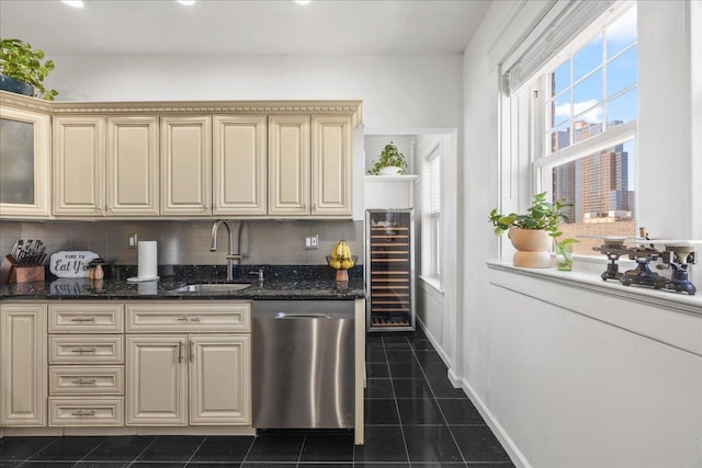 27 Locust Ave Unit 4N, New Rochelle, NY 10801 - kitchen with stainless steel dishwasher, a sink, beverage cooler, dark tile patterned flooring, and cream cabinetry